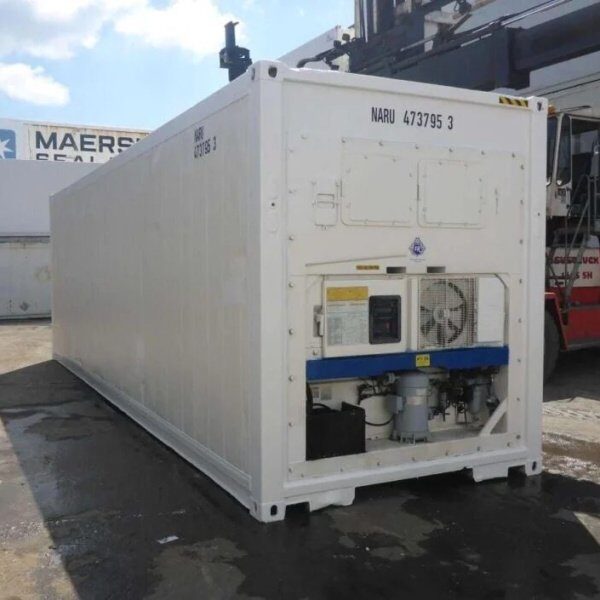 White refrigerated reefer container with its cooling unit visible