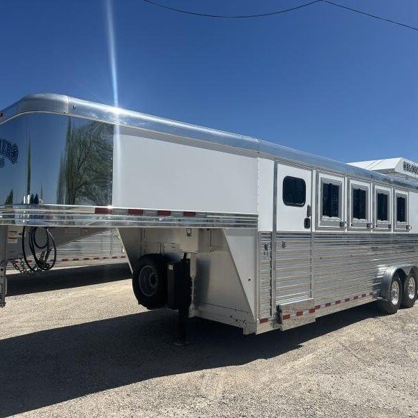 Aluminium horse trailer hitched to a pickup truck