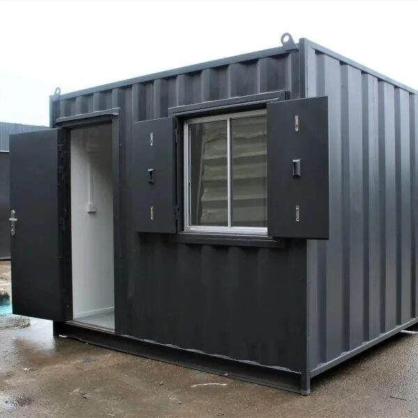 Container converted into a site office with windows and a door