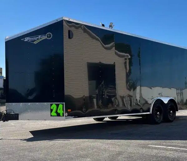 White enclosed cargo trailer with rear ramp door open