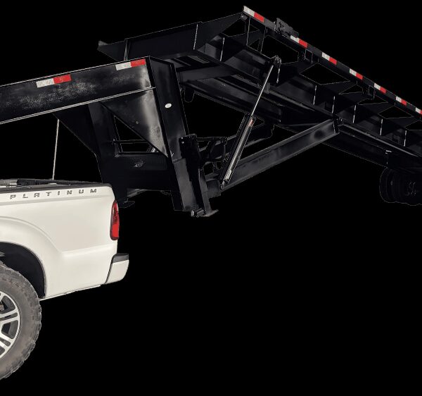 Pickup truck hitched to a horse trailer on a rural road